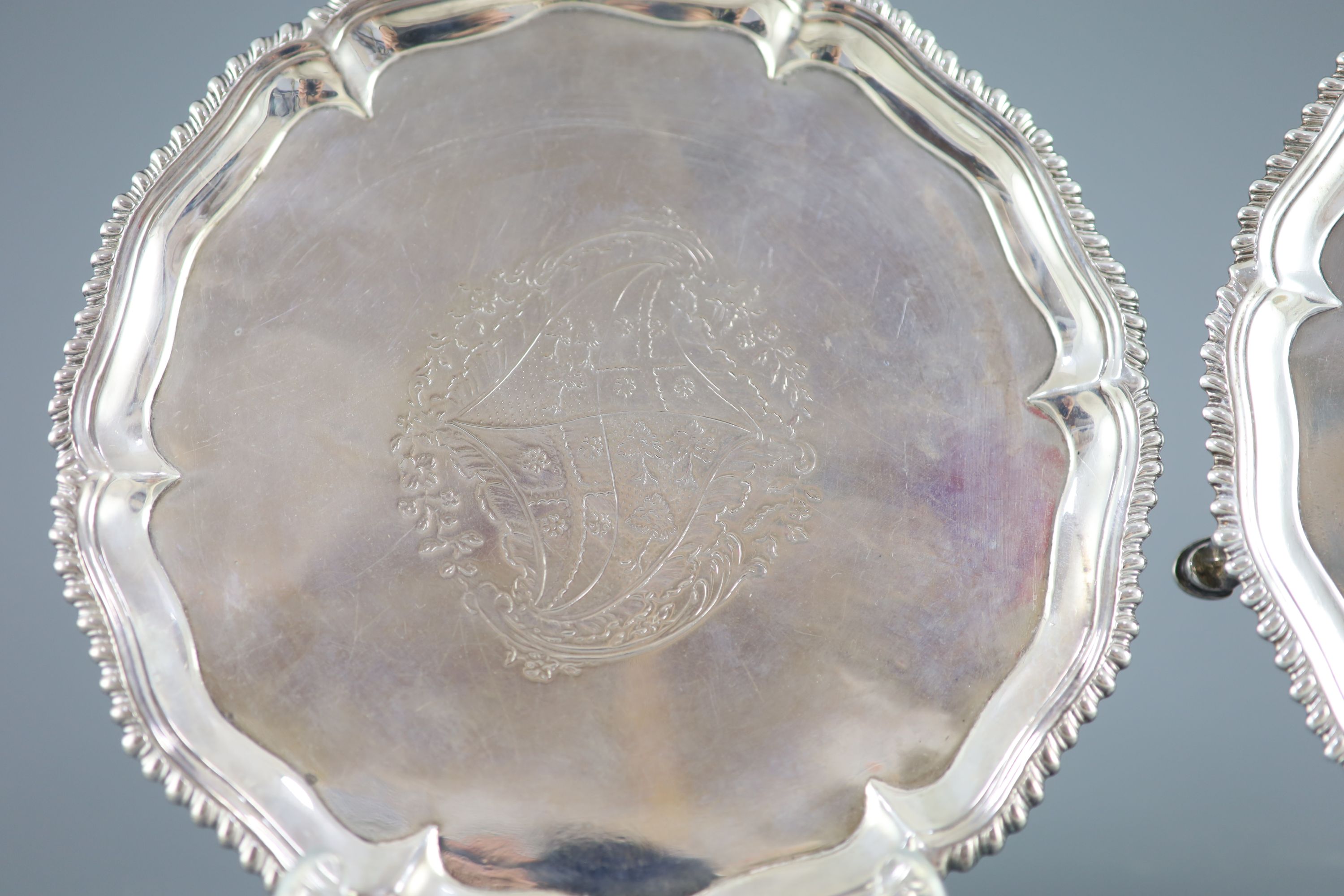 A pair of early George III silver salvers by Richard Rugg,